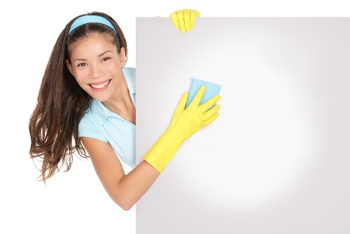 Interior window cleaning in a bright living room